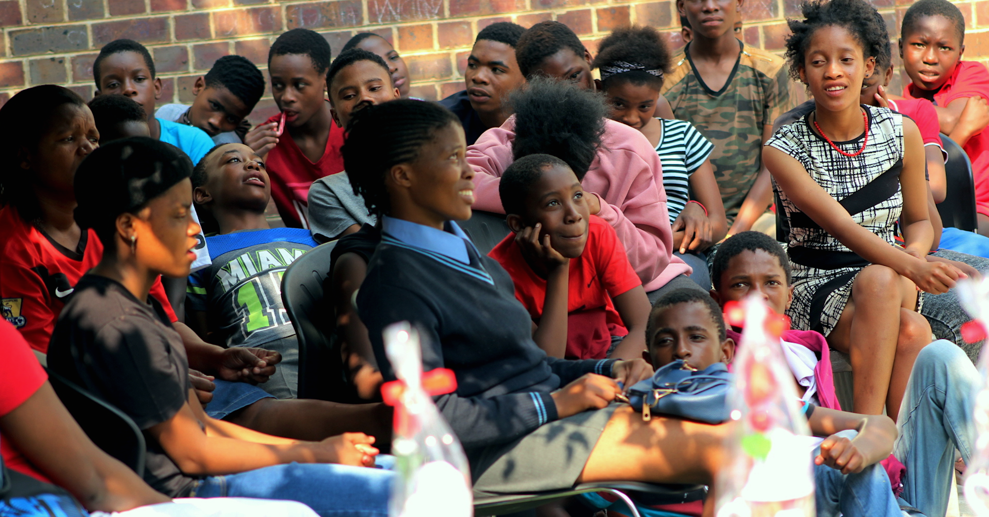 Young South Africans learn about HIV prevention during a school outreach program.