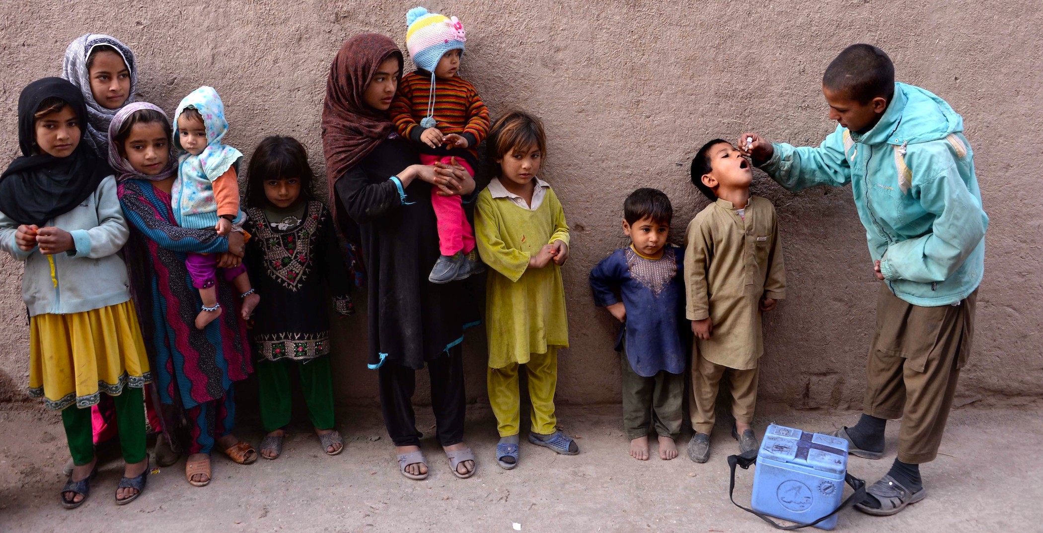 An Afghan health worker administers the polio vaccine to a child during a vaccination campaign in Jalalabad. | NOORULLAH SHIRZADA/AFP via Getty Images