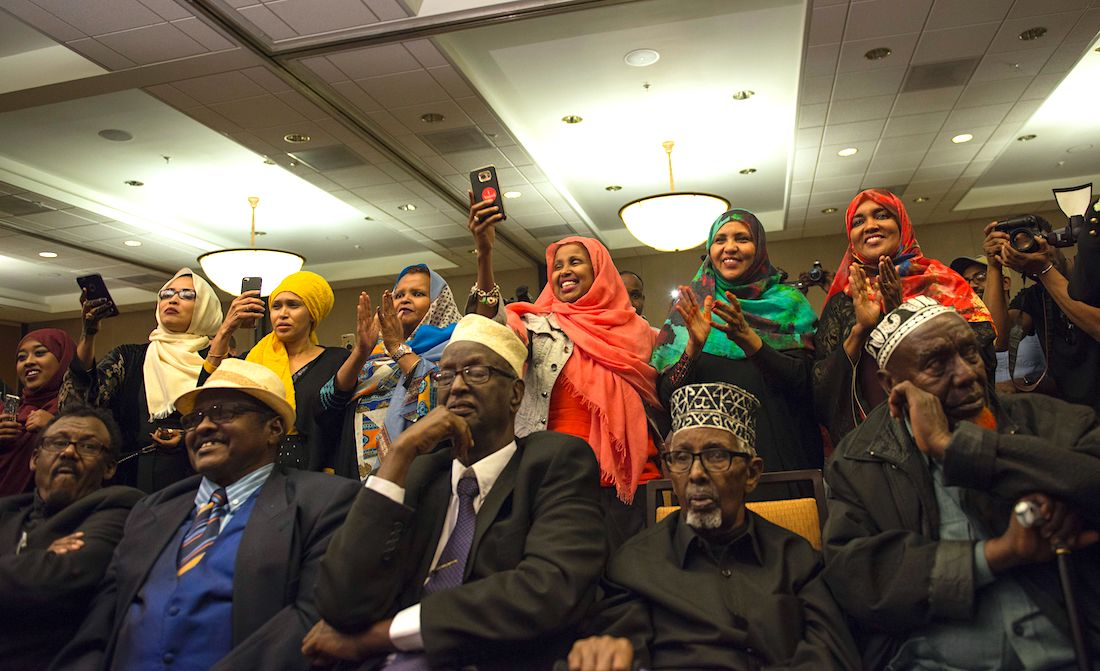Supporters of Ilhan Omar, candidate for State Representative for District 60B in Minnesota, celebrate on election night, November 8, 2016 in Minneapolis, Minnesota. Omar, a refugee from Somalia, is the first Somali-American Muslim woman to hold public office. |STEPHEN MATUREN/AFP via Getty Images