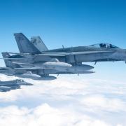 Four U.S. F-16 fighting falcons fly in formation with two Canadian CF-188 Hornets over the skies of Labrador, Canada, Sept. 20, 2020. The aircraft participated in a North American Aerospace Defense Command Arctic Air Defense Operation.