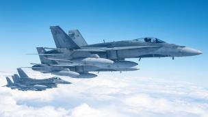 Four U.S. F-16 fighting falcons fly in formation with two Canadian CF-188 Hornets over the skies of Labrador, Canada, Sept. 20, 2020. The aircraft participated in a North American Aerospace Defense Command Arctic Air Defense Operation.