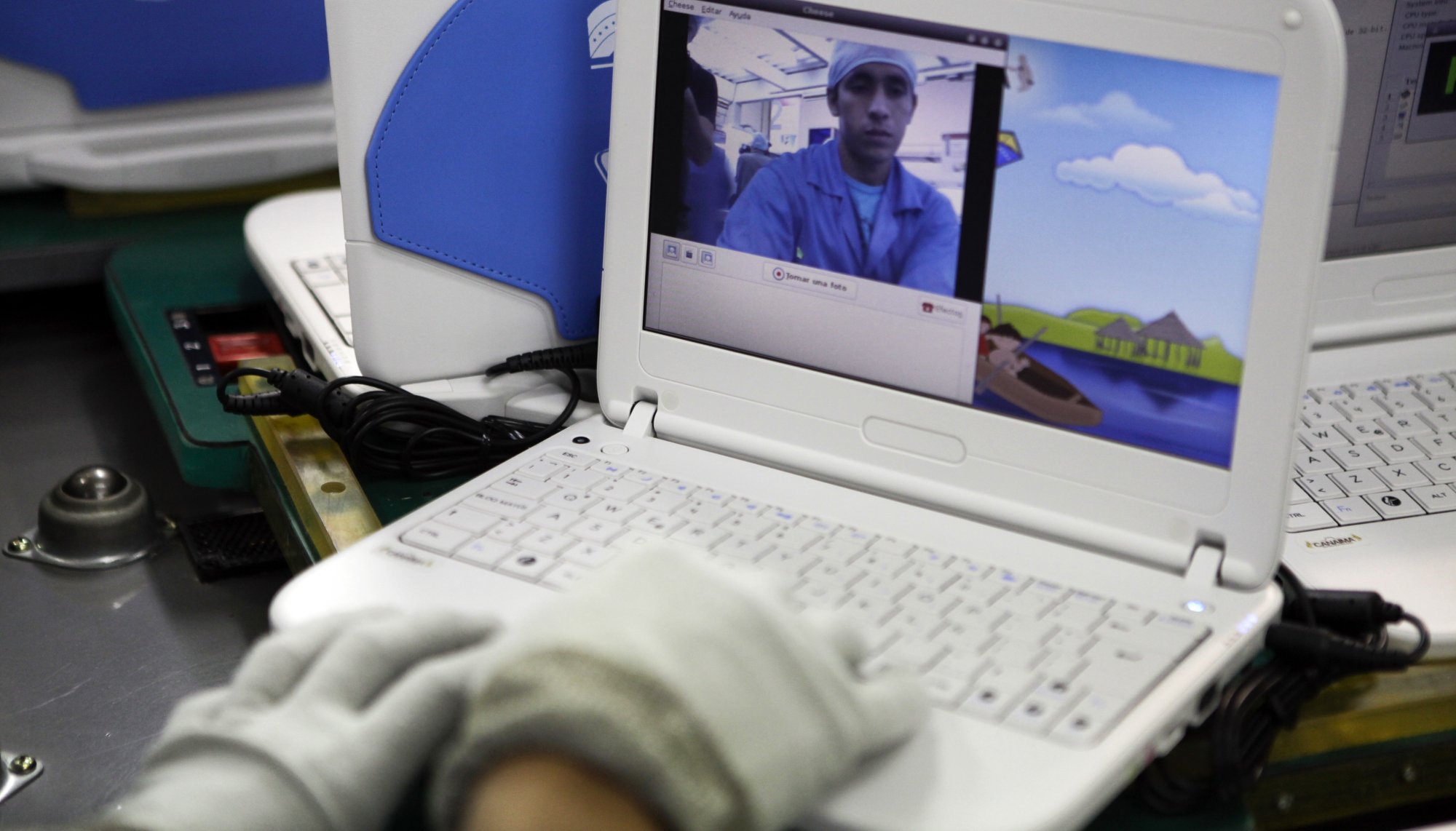 A technician programs a "Canaima" educational computer in Caracas.