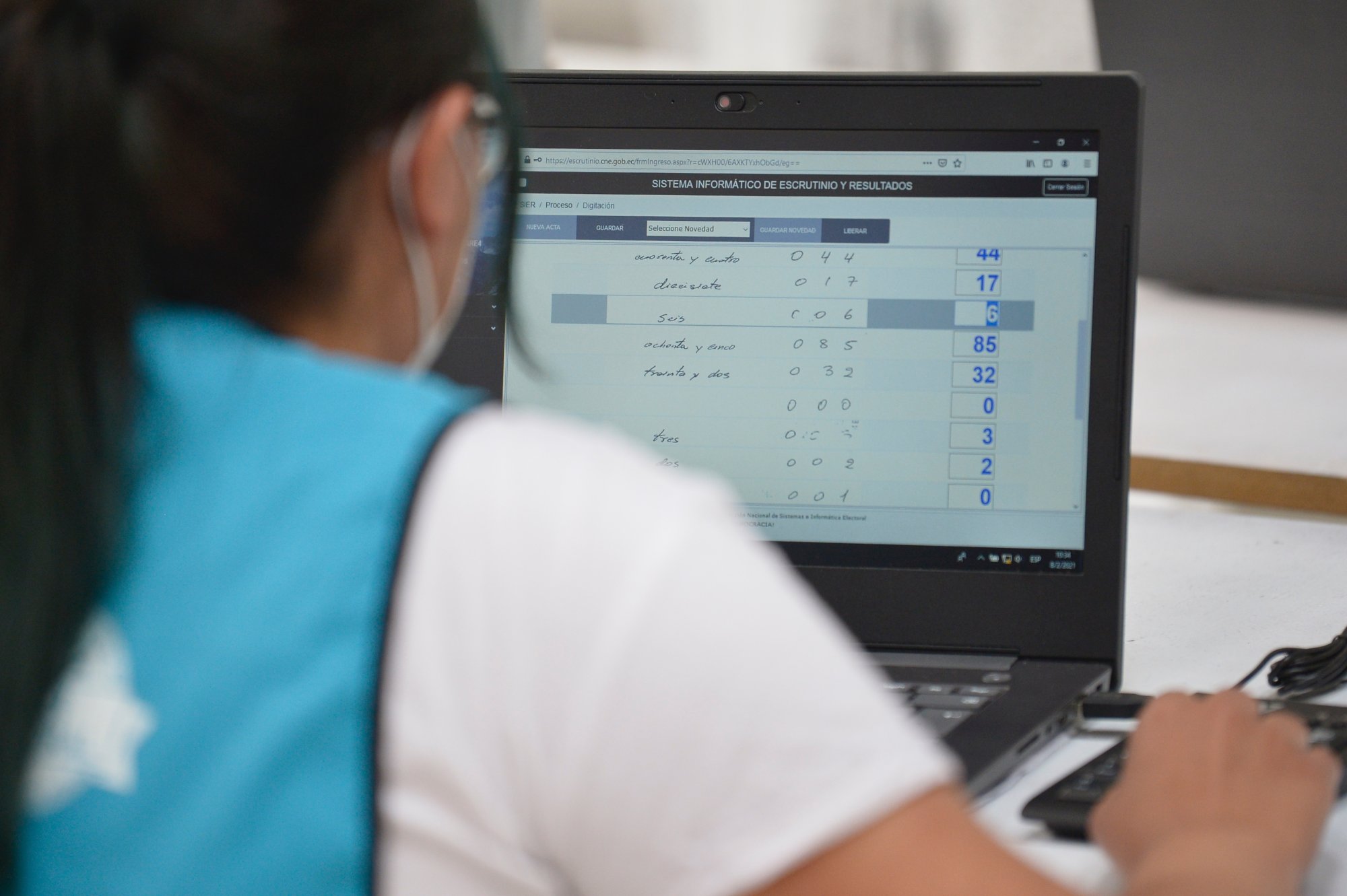 A worker of the National Council carries out the voting data digitization after Ecuador's general elections. 