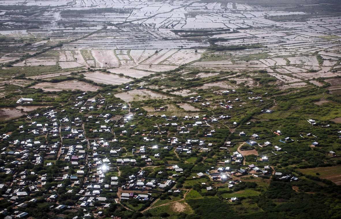 Residential areas and farming fields remain flooded at the outskirts of Beledweyne, Somalia. The rains have forced thousands of people to leave their houses and look for humanitarian assistance while living in displacement camps. | LUIS TATO/AFP via Getty Images