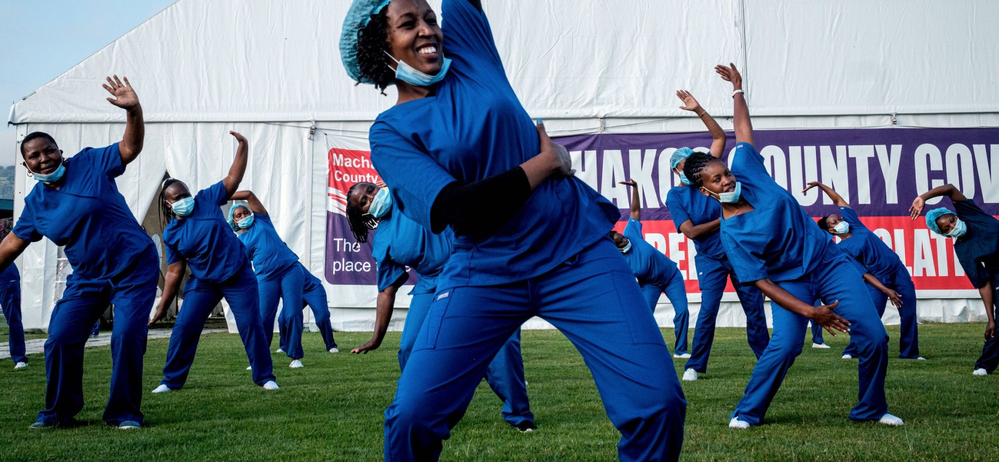 The Nursing Council of Kenya organizes dance sessions for health care providers to re-energize and uplift their sprits during this pandemic. | YASUYOSHI CHIBA:AFP via Getty Images 