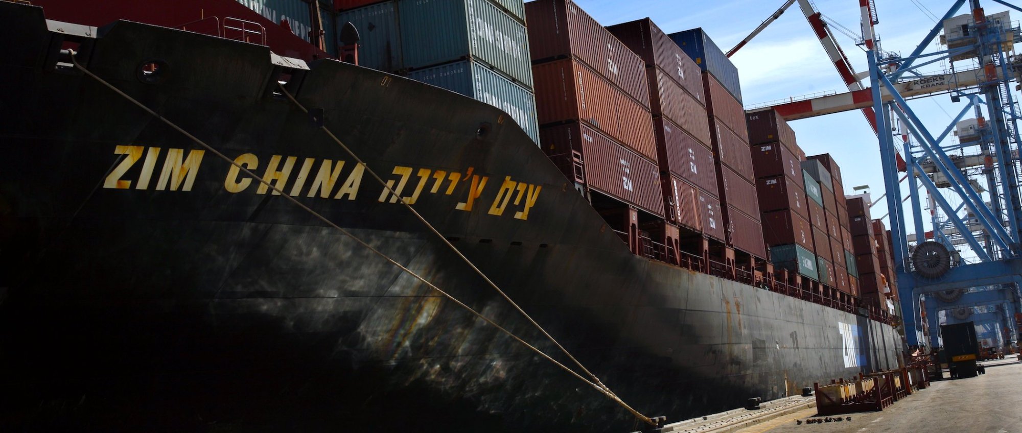 Workers unload containers off Zim China ship in the port of Haifa, Israel in 2007. 